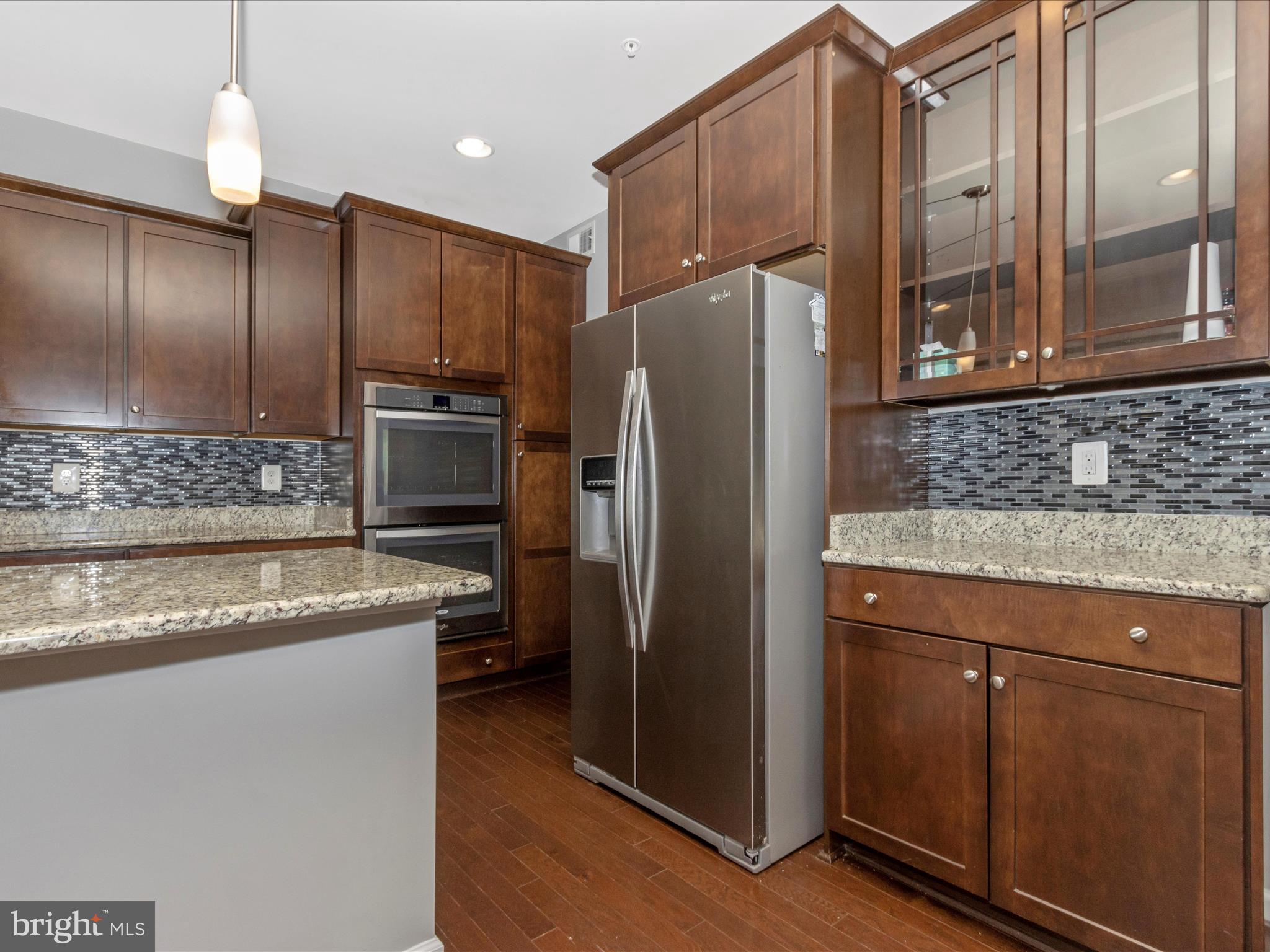 7208 Maisson Ridge Circle Beltsville, MD 20705 - Photo 17 of 53 a kitchen with stainless steel appliances granite countertop a refrigerator and a sink