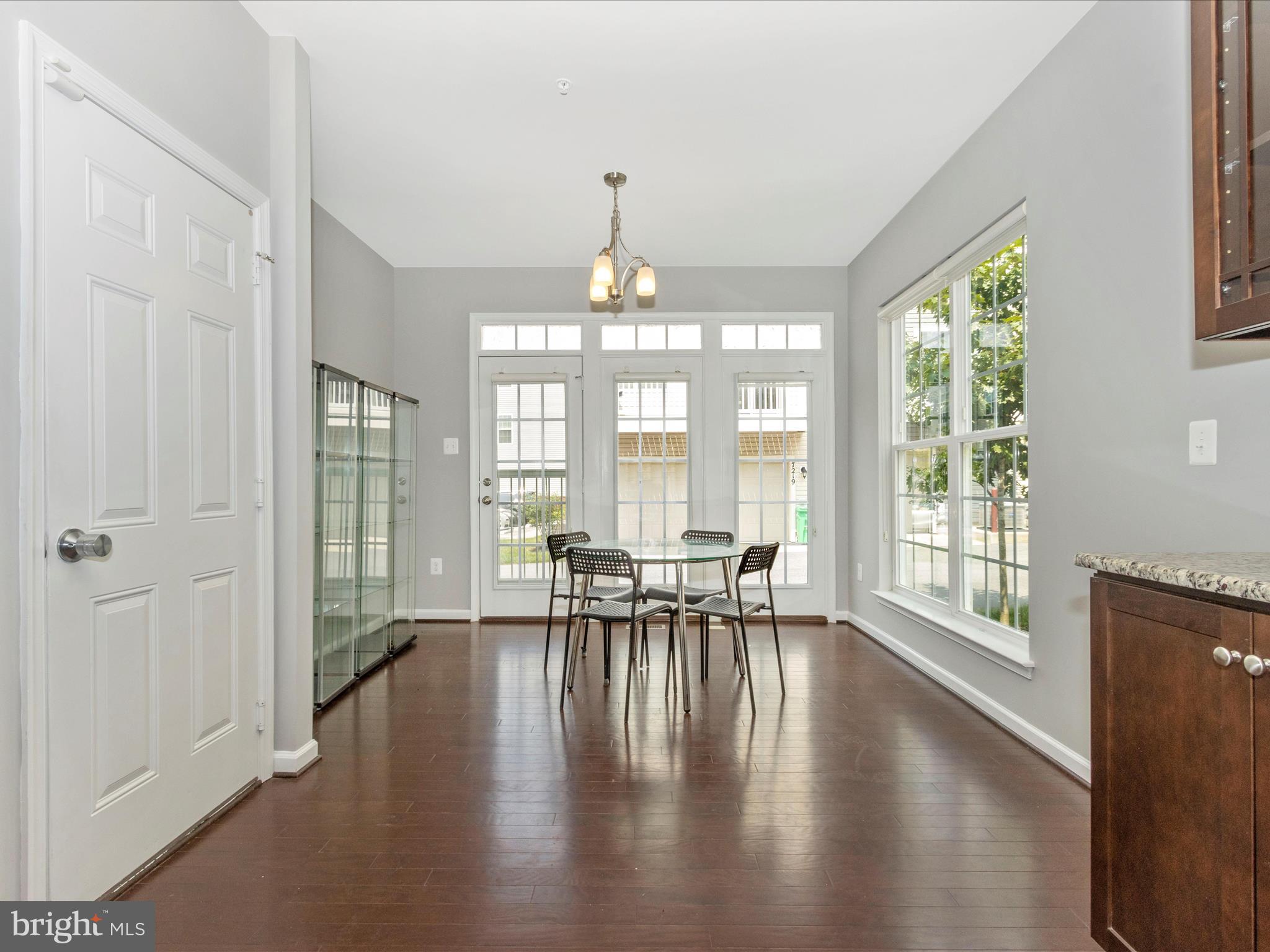 7208 Maisson Ridge Circle Beltsville, MD 20705 - Photo 18 of 53 a living room with furniture and a large window