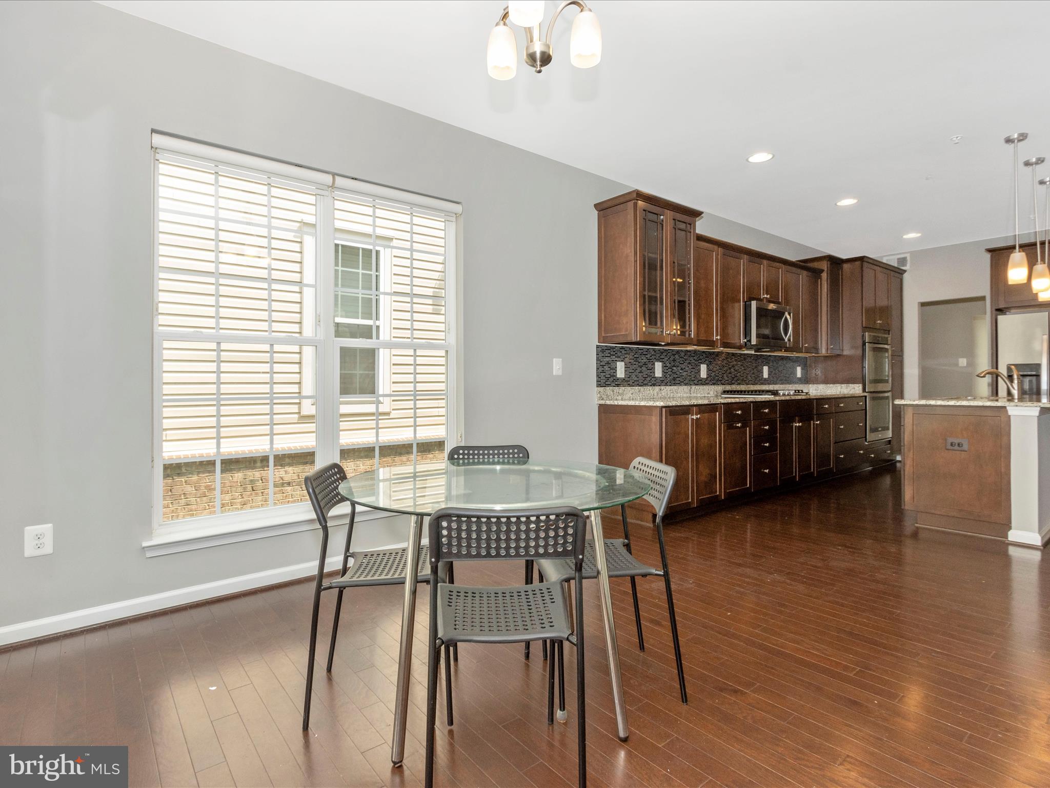 7208 Maisson Ridge Circle Beltsville, MD 20705 - Photo 19 of 53 a dining room with furniture and wooden floor