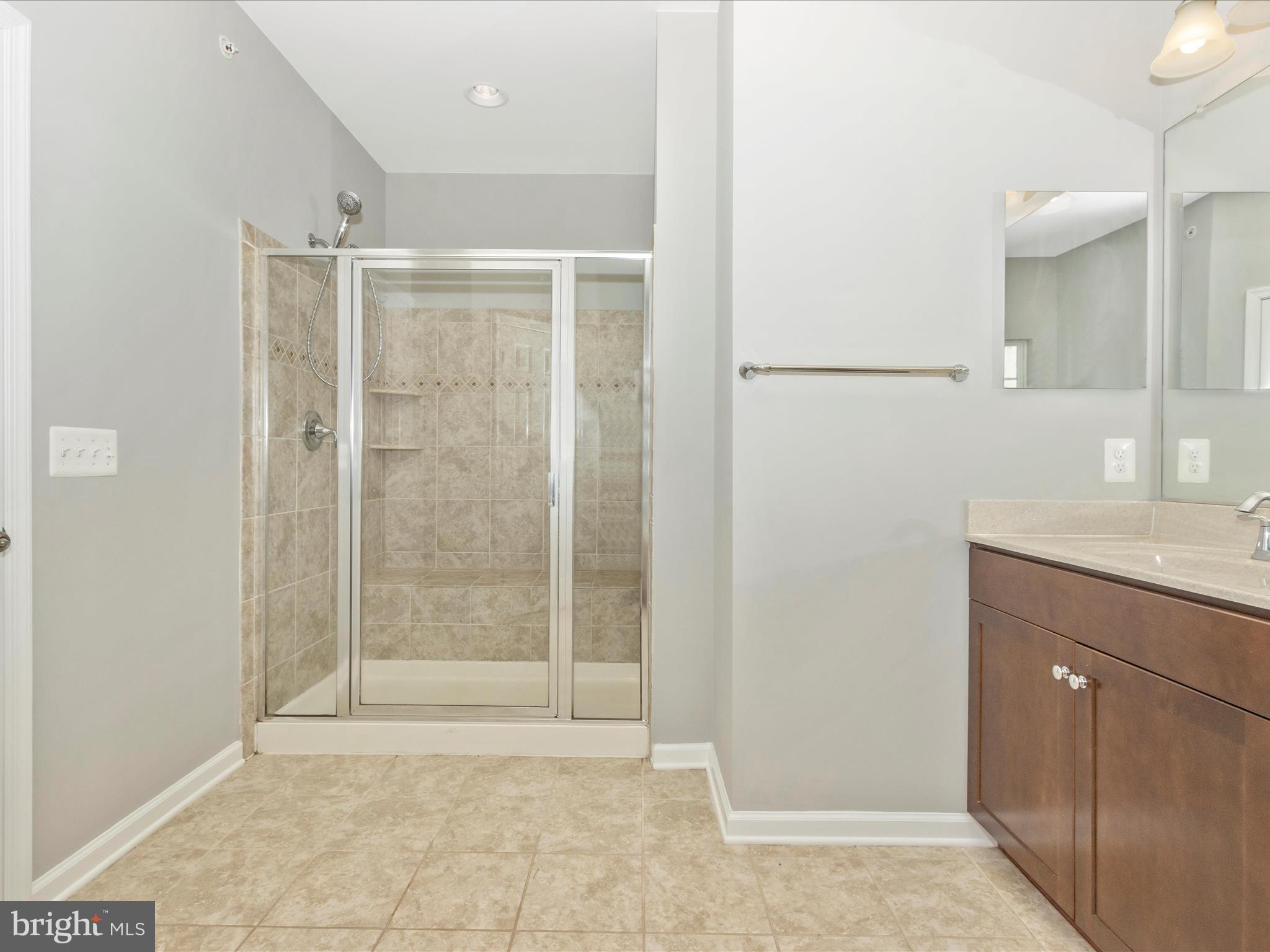 7208 Maisson Ridge Circle Beltsville, MD 20705 - Photo 26 of 53 a bathroom with a shower and a sink
