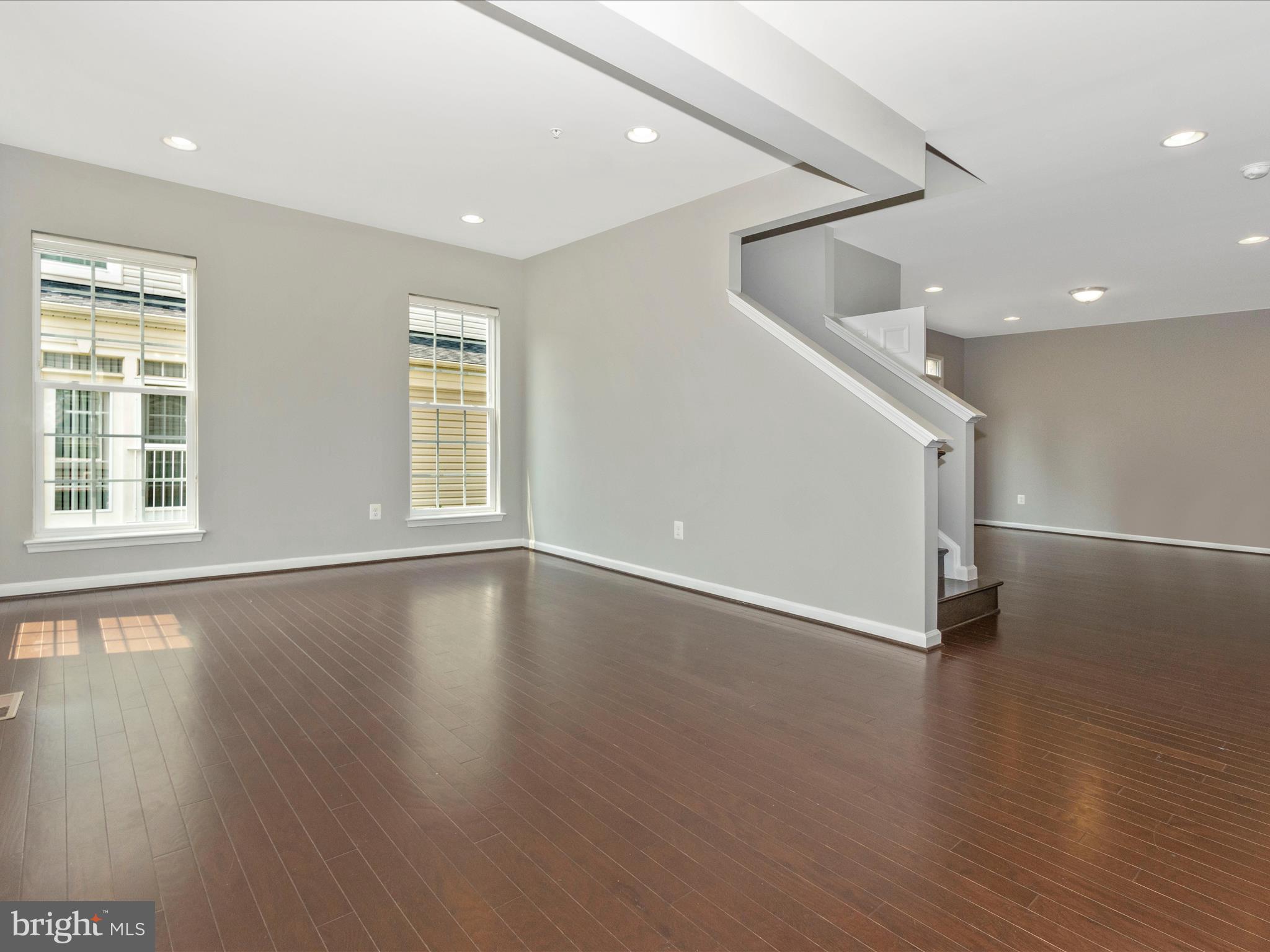 7208 Maisson Ridge Circle Beltsville, MD 20705 - Photo 3 of 53 an empty room with wooden floor and windows