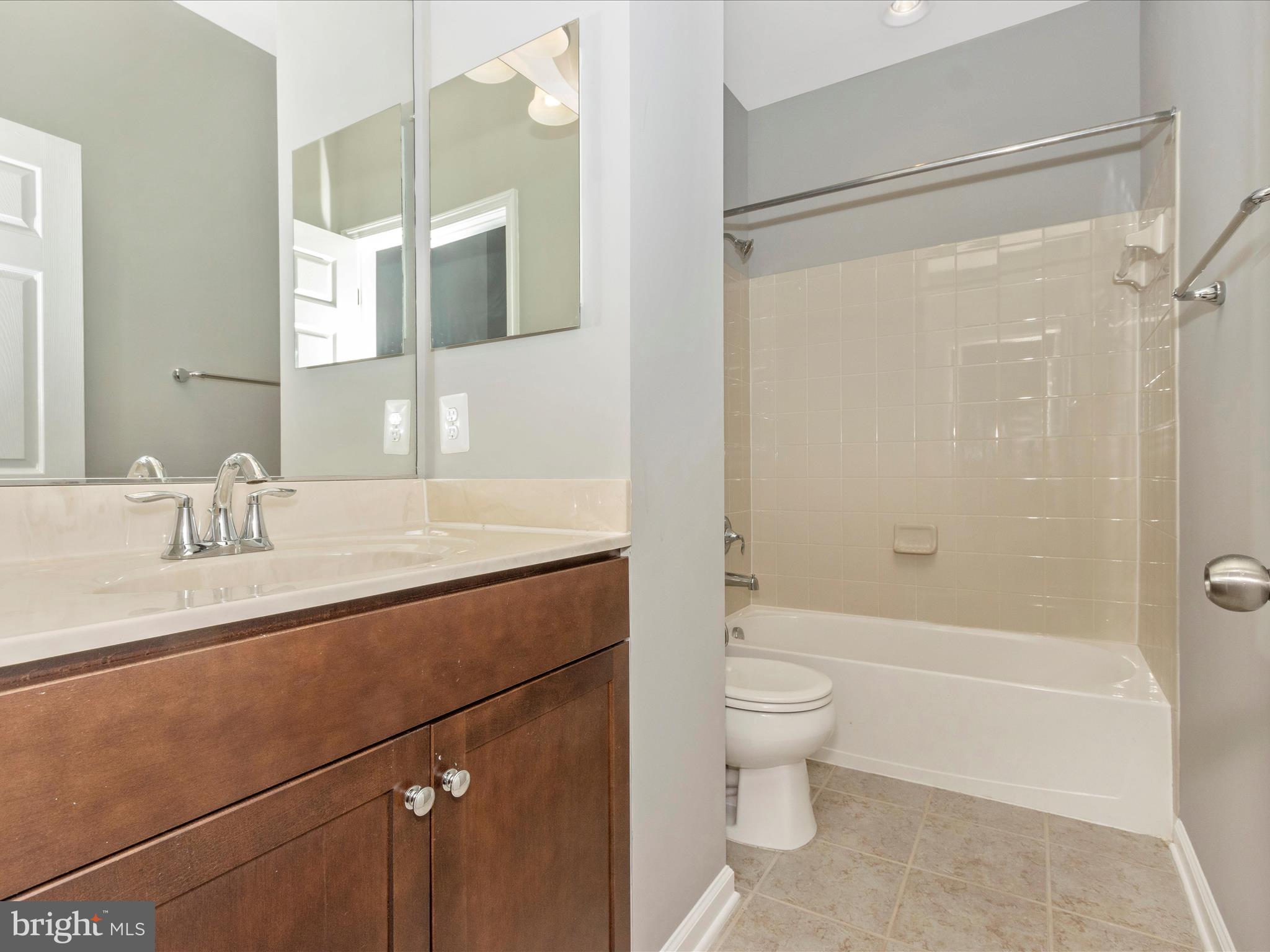 7208 Maisson Ridge Circle Beltsville, MD 20705 - Photo 31 of 53 a bathroom with a granite countertop sink toilet and shower