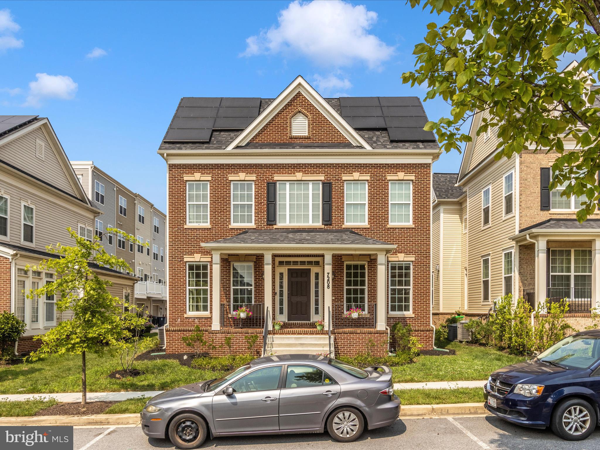 7208 Maisson Ridge Circle Beltsville, MD 20705 - Photo 40 of 53 a front view of a house with a yard