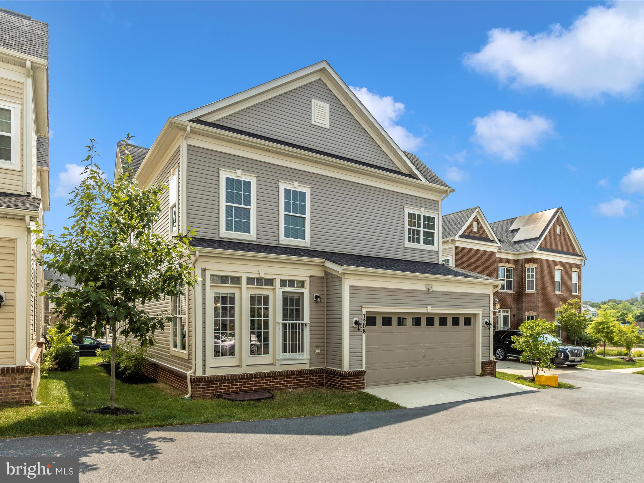 7208 Maisson Ridge Circle Beltsville, MD 20705 - Photo 47 of 53 a front view of a house with a garden