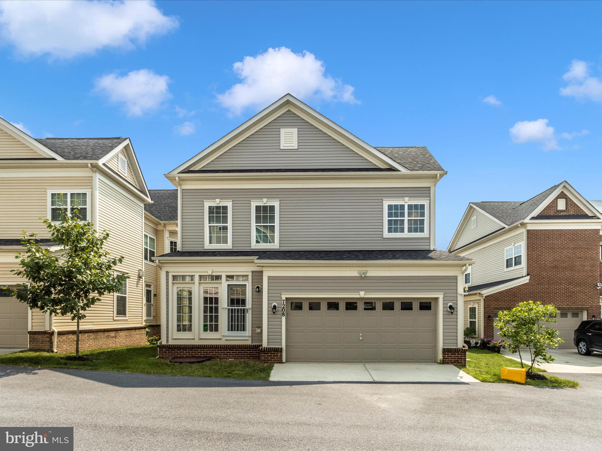 7208 Maisson Ridge Circle Beltsville, MD 20705 - Photo 48 of 53 a front view of a house with a garden