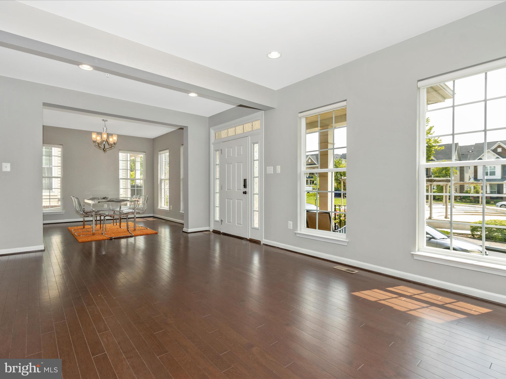7208 Maisson Ridge Circle Beltsville, MD 20705 - Photo 5 of 53 a view of an empty room with wooden floor and a window