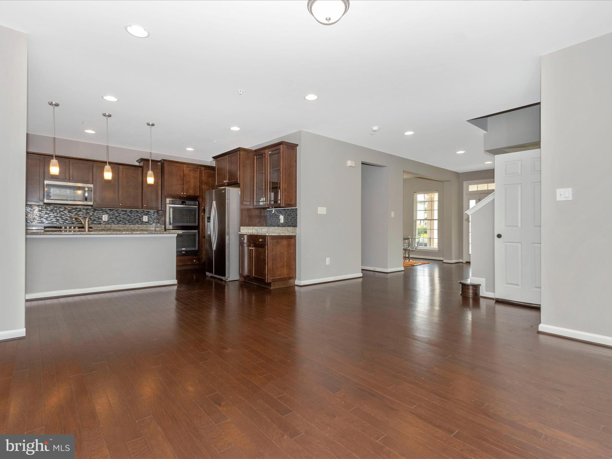 7208 Maisson Ridge Circle Beltsville, MD 20705 - Photo 10 of 53 a view of a kitchen with a sink and a stove top oven