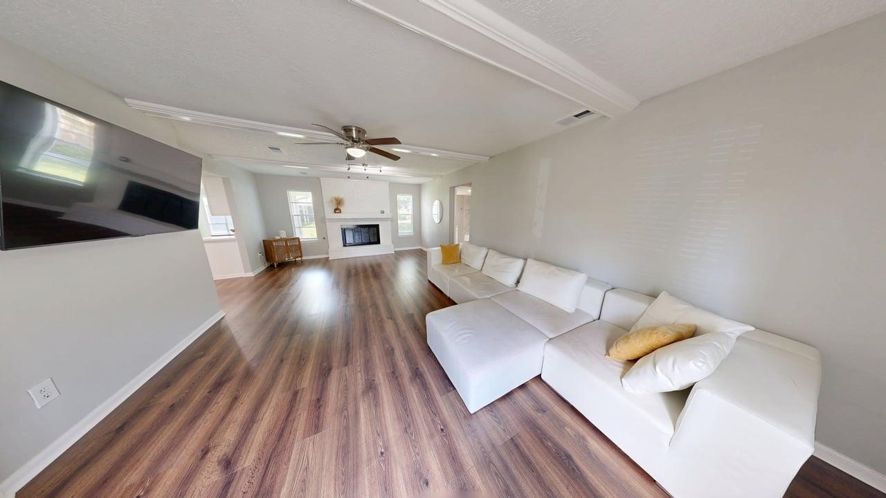 619 Cotter Drive Spring, TX 77373 - Photo 10 of 50 a living room with couches and kitchen view with wooden floor