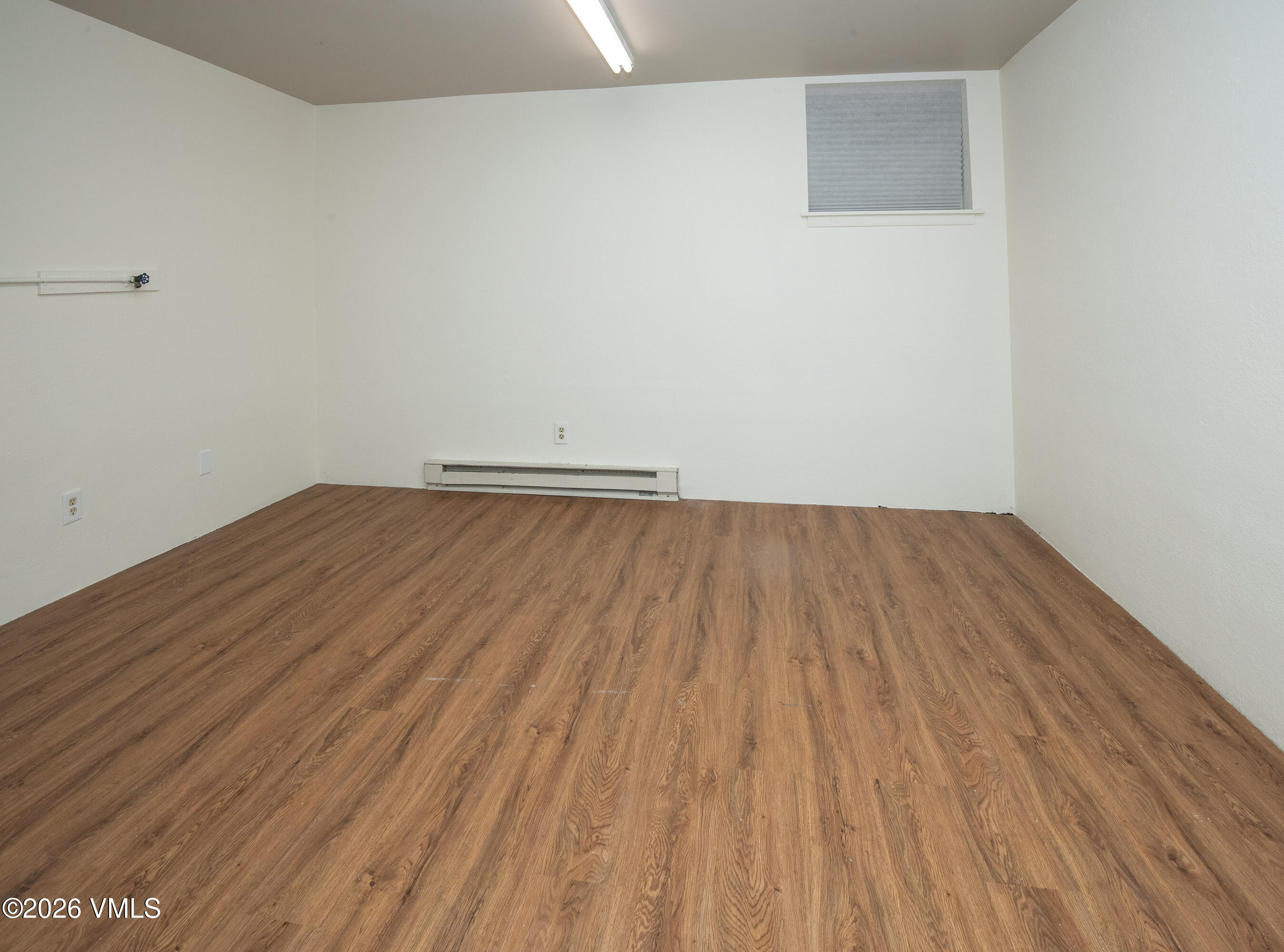 85 Chambers Avenue, Unit 10 Eagle, CO 81631 - Photo 27 of 41 a view of room with wooden floor