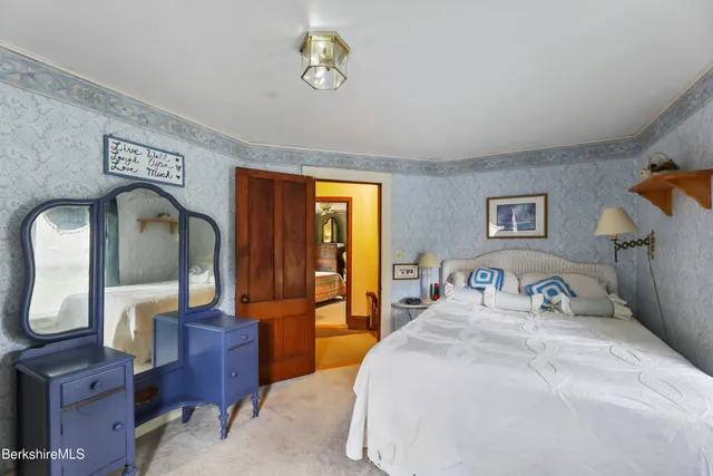 a front view of a house with a yard and a garage