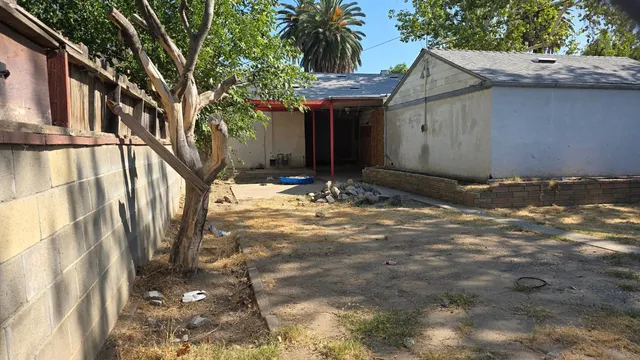 a view of a house with a snow in the yard