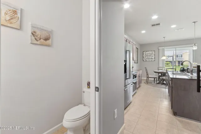 a bathroom with a tub a sink and a mirror