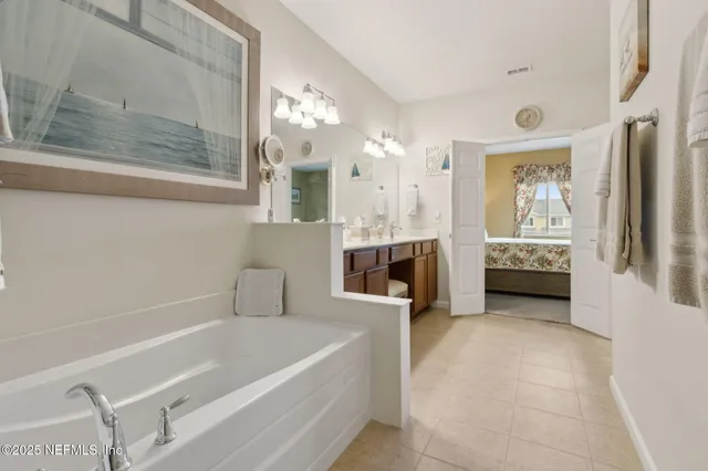 a bathroom with a sink toilet and a mirror