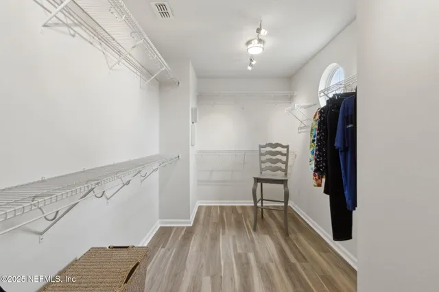 a view of a balcony with chair and glass door