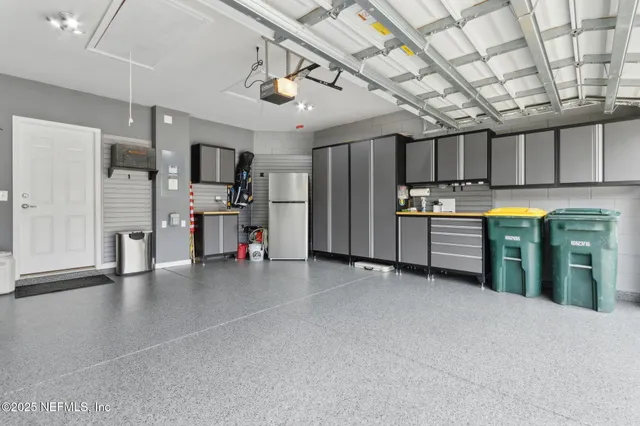 a view of a lake with boats and trees in the background