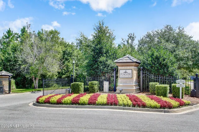 a living room with furniture kitchen view and a flat screen tv