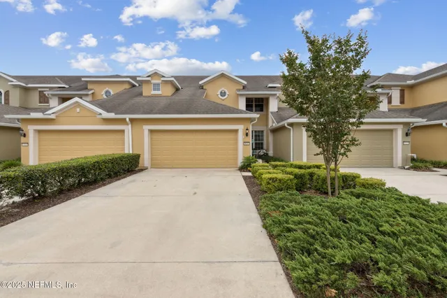 a large kitchen with a table and chairs