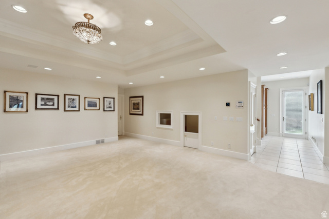 1714 Ridge Point Drive Bountiful, UT 84010 - Photo 73 of 132 Recessed lighting, tray ceiling, crystal chandelier, neutral carpeting, and tile flooring