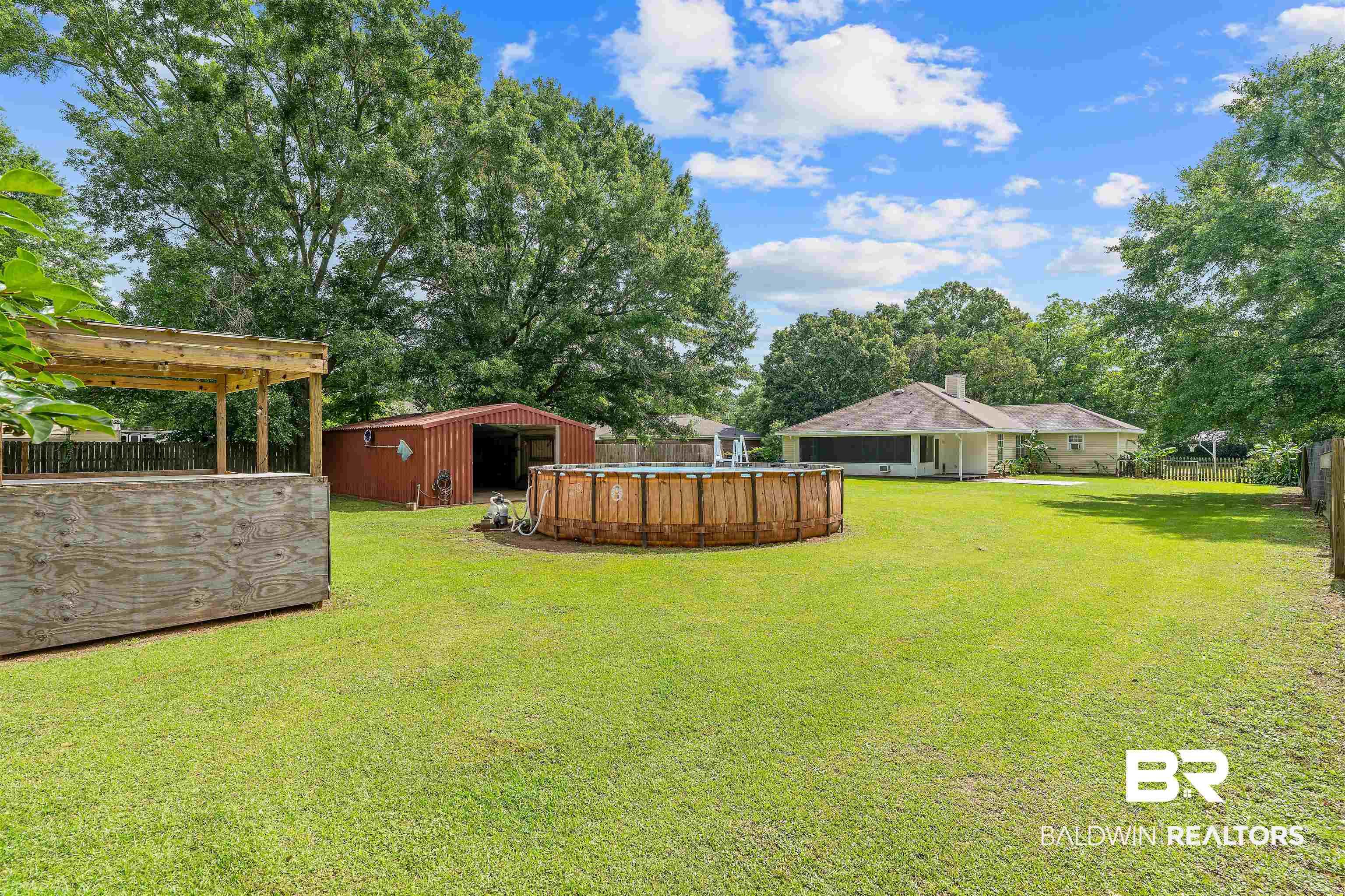 25779 Austin Road Daphne, AL 36526 - Photo 8 of 30 View of yard with an outdoor pool and an outbuilding