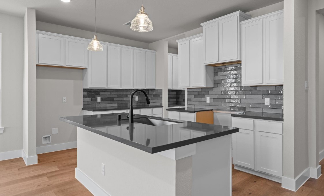 325 Gambels Quail Road Hempstead, TX 77445 - Photo 3 of 21 a kitchen with stainless steel appliances granite countertop a sink a stove and a refrigerator