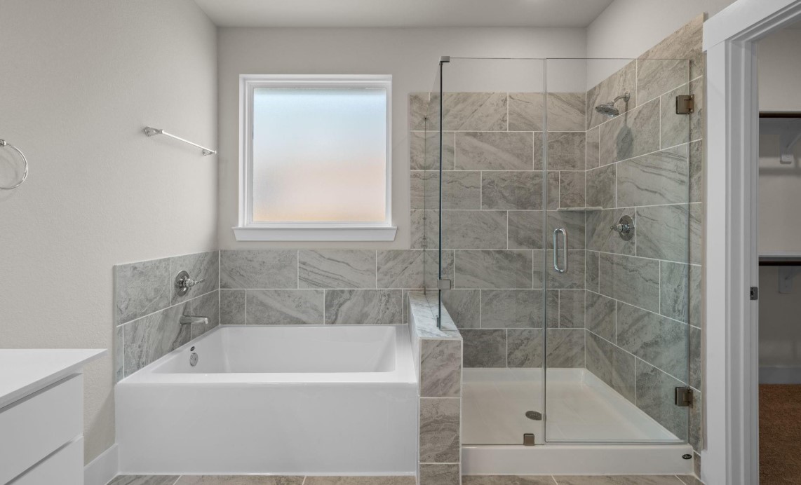 325 Gambels Quail Road Hempstead, TX 77445 - Photo 10 of 21 a white bath tub sitting next to a shower