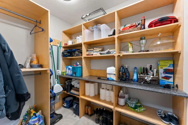 a kitchen with lots of bottles of alcohol