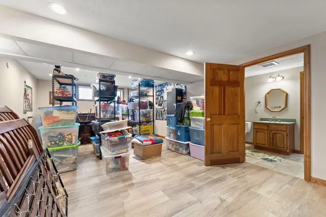 a bathroom with a toilet a sink and a mirror