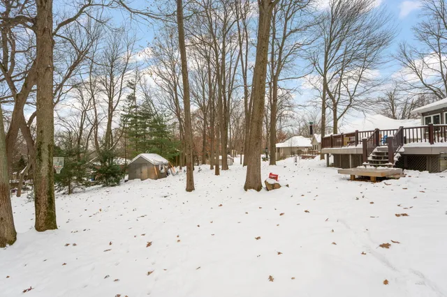 a view of a house with snow on the roof
