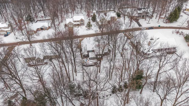 a picture of white wall with a snow in back yard