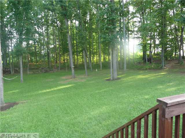 8914 Grove Park Drive Oak Ridge, NC 27310 - Photo 14 of 16 Yard/Garden. Treed backyard offers park-like setting for all your family gatherings.