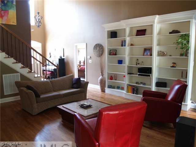 8914 Grove Park Drive Oak Ridge, NC 27310 - Photo 3 of 16 Den/Family/Great Room. Beautiful artisan-crafted shelves flank the great room wall.