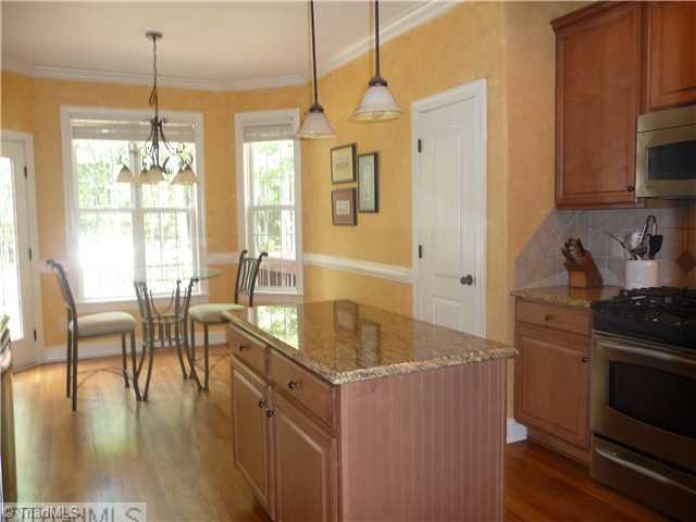 8914 Grove Park Drive Oak Ridge, NC 27310 - Photo 5 of 16 Breakfast. Relax during any meal with plenty of windows to guarantee an unrestrained view.