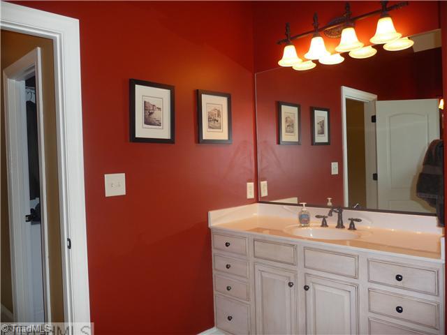 8914 Grove Park Drive Oak Ridge, NC 27310 - Photo 9 of 16 Master Bath/Spa. His & her sinks, separate shower, jetted tub compliment the master suite.