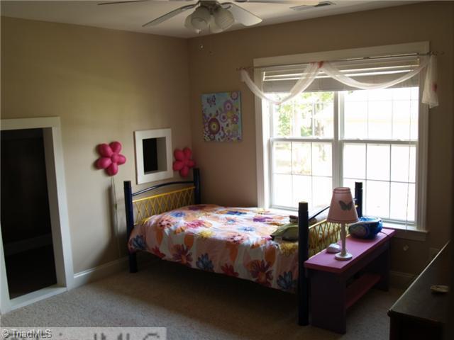 8914 Grove Park Drive Oak Ridge, NC 27310 - Photo 10 of 16 1st Bedroom. Ist bedroom offers an enchanting bonus with child-sized play area just through the special doorway.