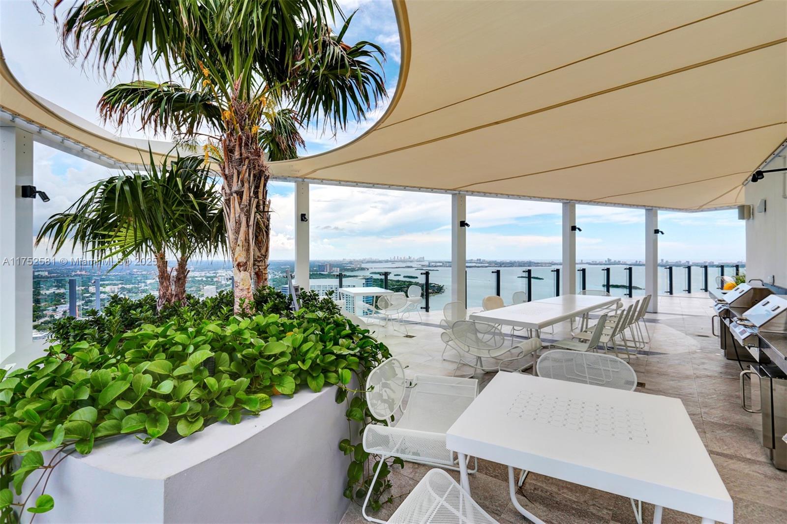 501 Northeast 31st Street, Unit 910 Miami, FL 33137 - Photo 11 of 84 a view of a swimming pool with chairs