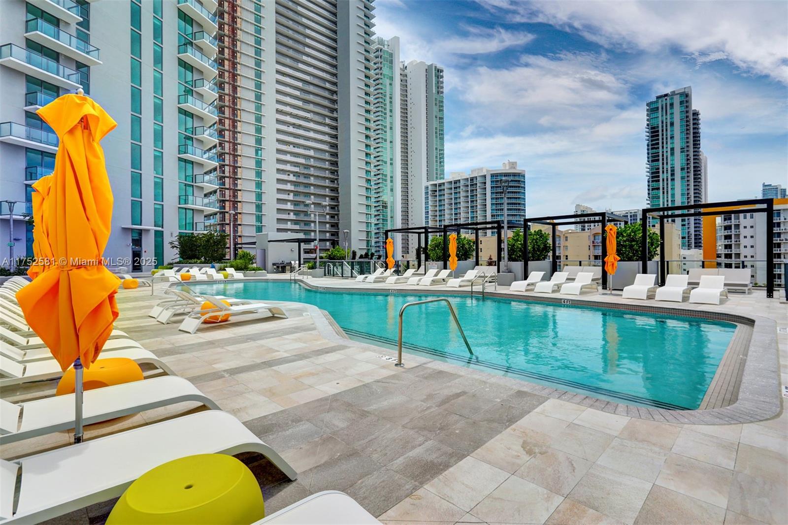 501 Northeast 31st Street, Unit 910 Miami, FL 33137 - Photo 26 of 84 a view of swimming pool with a lounge chairs