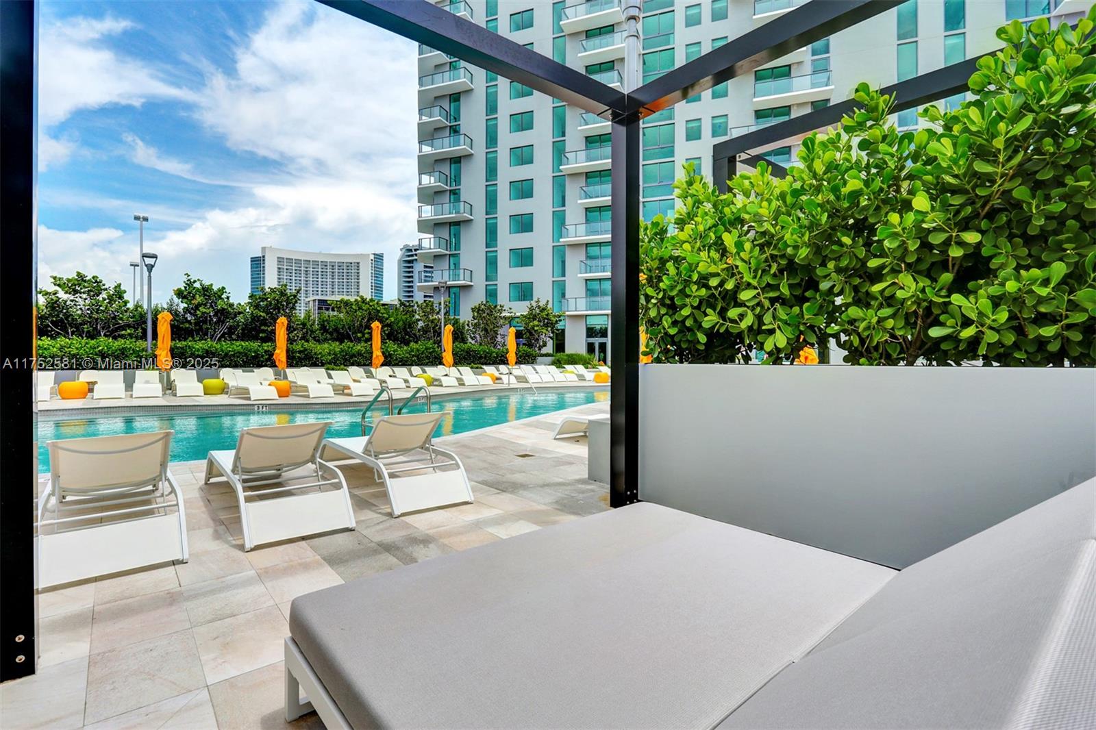 501 Northeast 31st Street, Unit 910 Miami, FL 33137 - Photo 29 of 84 a view of a patio with a table and chairs and potted plants