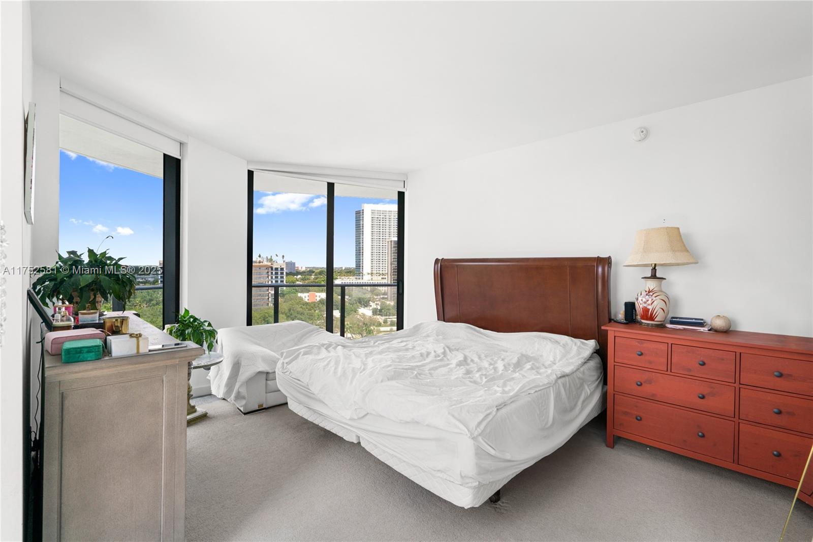 501 Northeast 31st Street, Unit 910 Miami, FL 33137 - Photo 57 of 84 a bedroom with a bed table and a window