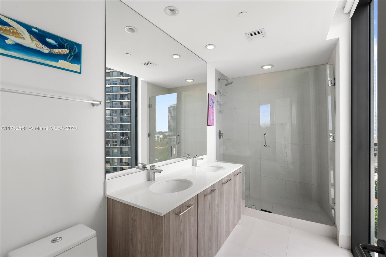 501 Northeast 31st Street, Unit 910 Miami, FL 33137 - Photo 60 of 84 a bathroom with a sink a toilet and shower