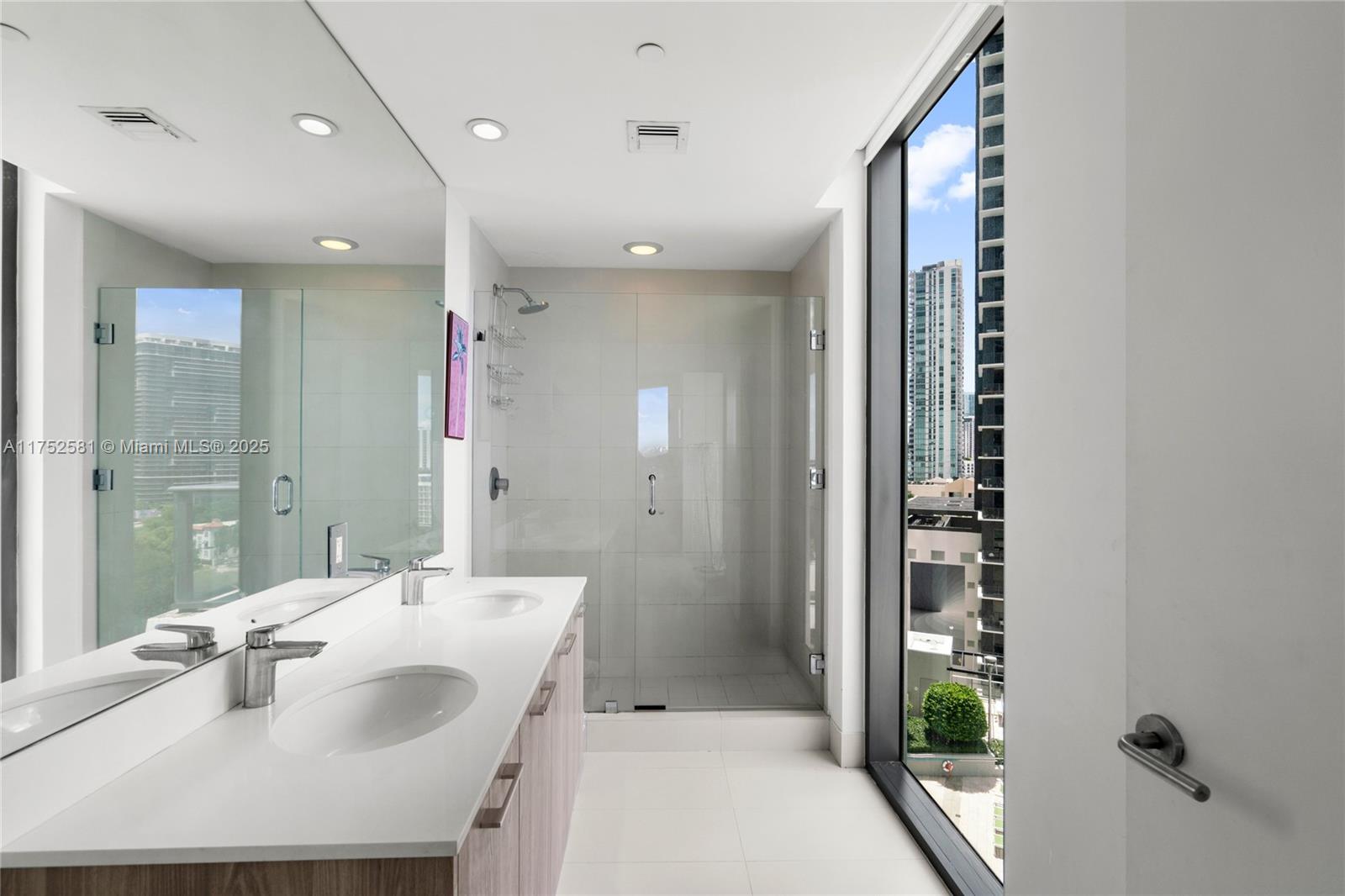 501 Northeast 31st Street, Unit 910 Miami, FL 33137 - Photo 61 of 84 a bathroom with a sink and a mirror