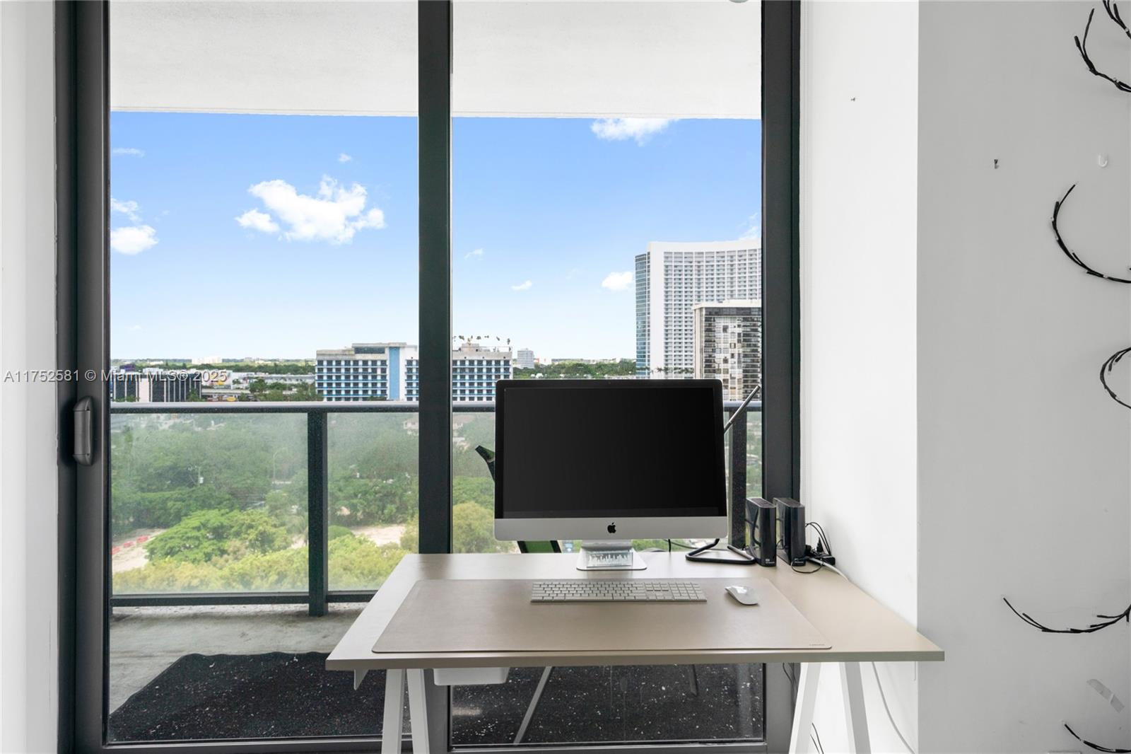 501 Northeast 31st Street, Unit 910 Miami, FL 33137 - Photo 70 of 84 a desktop computer sitting on top of a desk