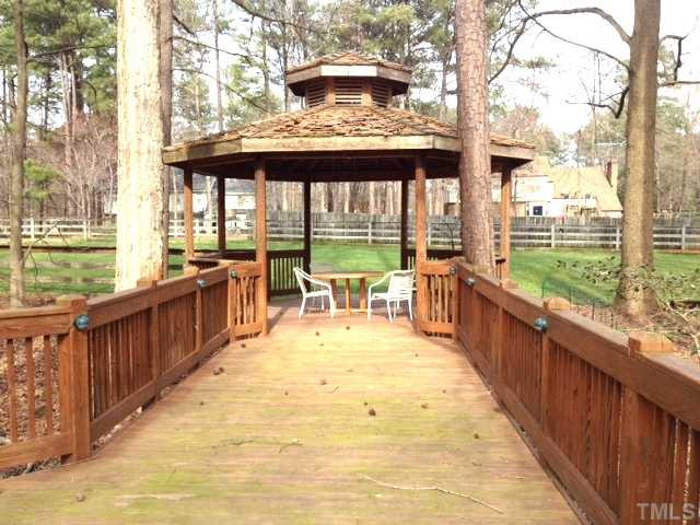8812 Trailing Cedar Drive Raleigh, NC 27613 - Photo 22 of 25 Decking to Gazebo that overlooks the lovely fenced backyard. Patio/Deck