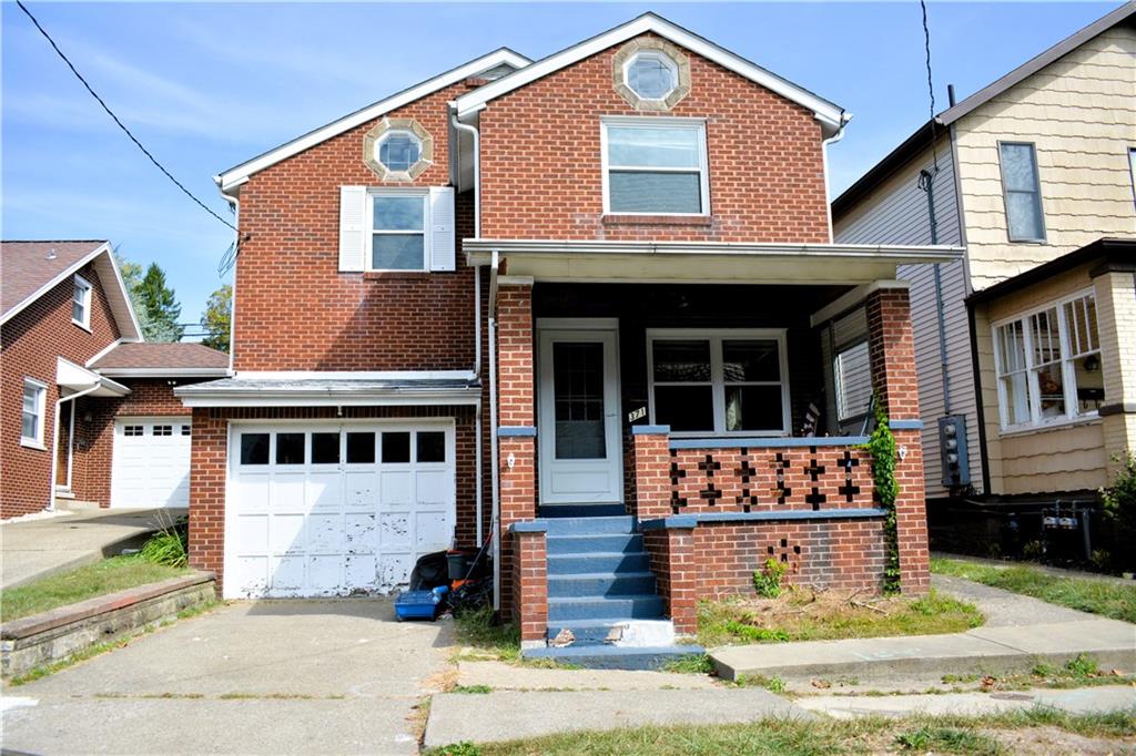 371 Main Street Leechburg, PA 15656 - Photo 1 of 24 a front view of a house with garden