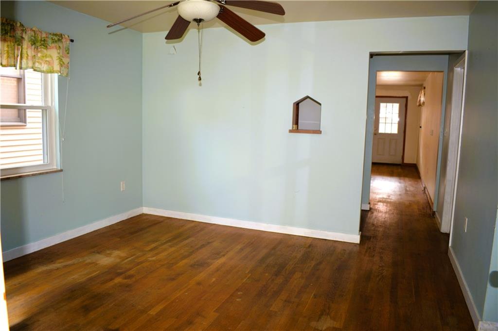 371 Main Street Leechburg, PA 15656 - Photo 6 of 24 wooden floor in an empty room with a window