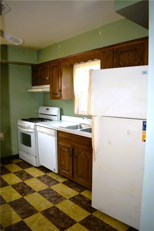 371 Main Street Leechburg, PA 15656 - Photo 7 of 24 a kitchen with a sink a stove and a refrigerator