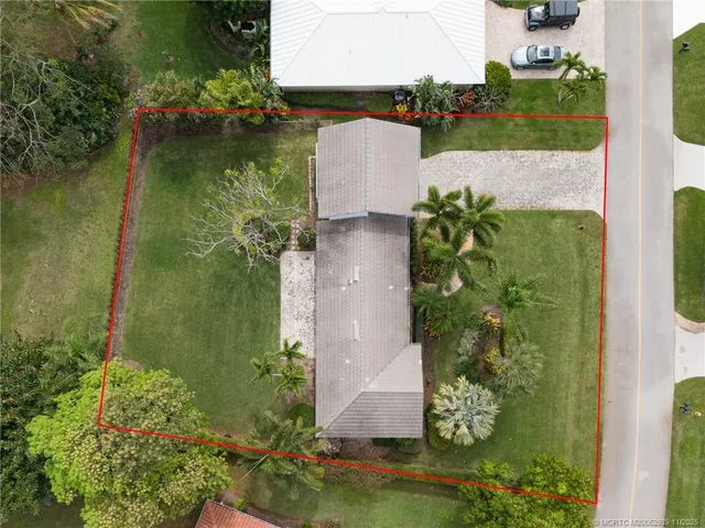 an aerial view of a residential houses with outdoor space
