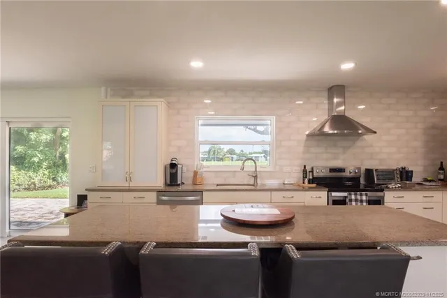 a kitchen with a sink and a refrigerator