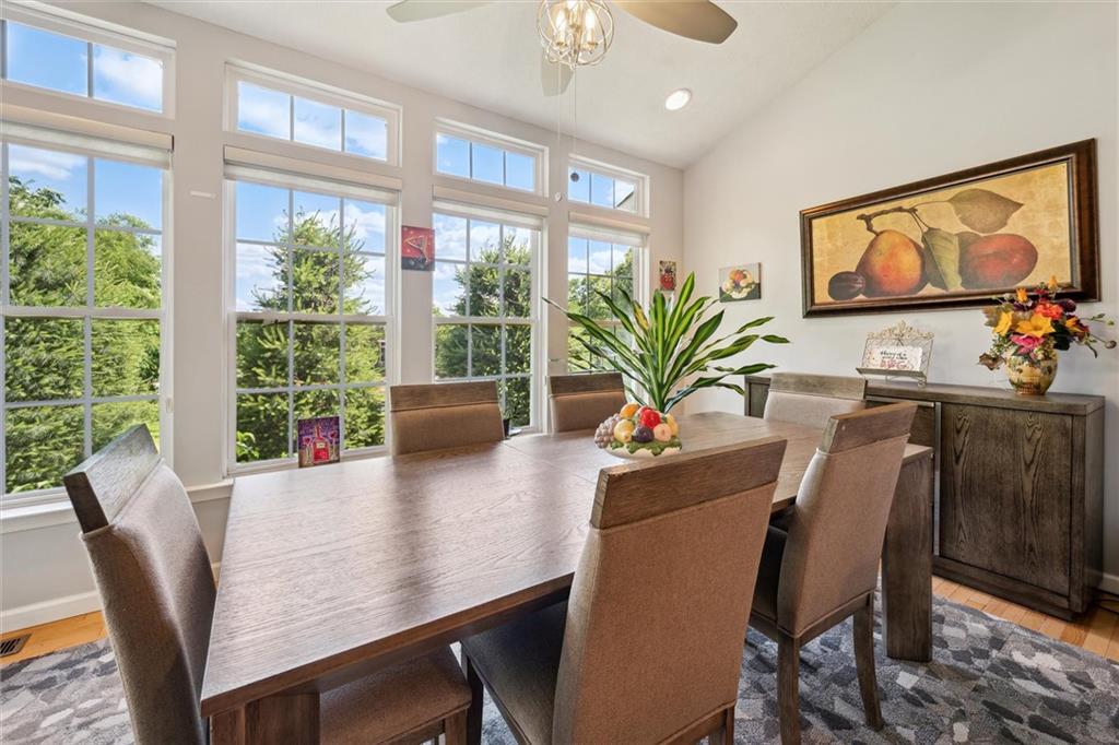 136 Park Place McKees Rocks, PA 15136 - Photo 18 of 49 a dining room with furniture potted plants and wooden floor