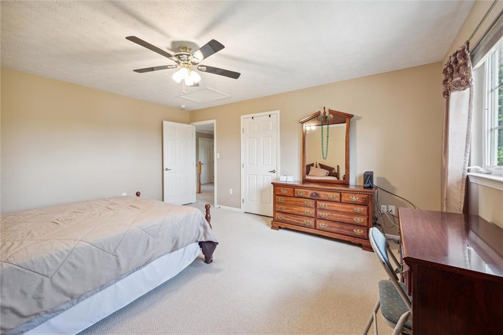 136 Park Place McKees Rocks, PA 15136 - Photo 31 of 49 a bedroom with a bed and a chandelier