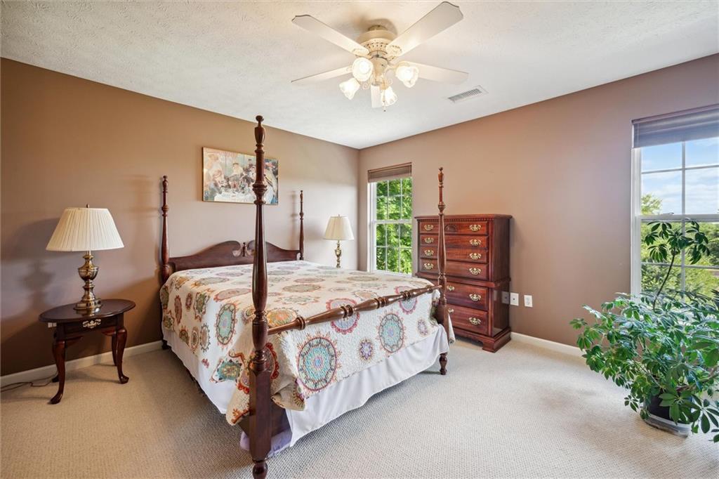 136 Park Place McKees Rocks, PA 15136 - Photo 32 of 49 a bedroom with a bed chandelier and a window